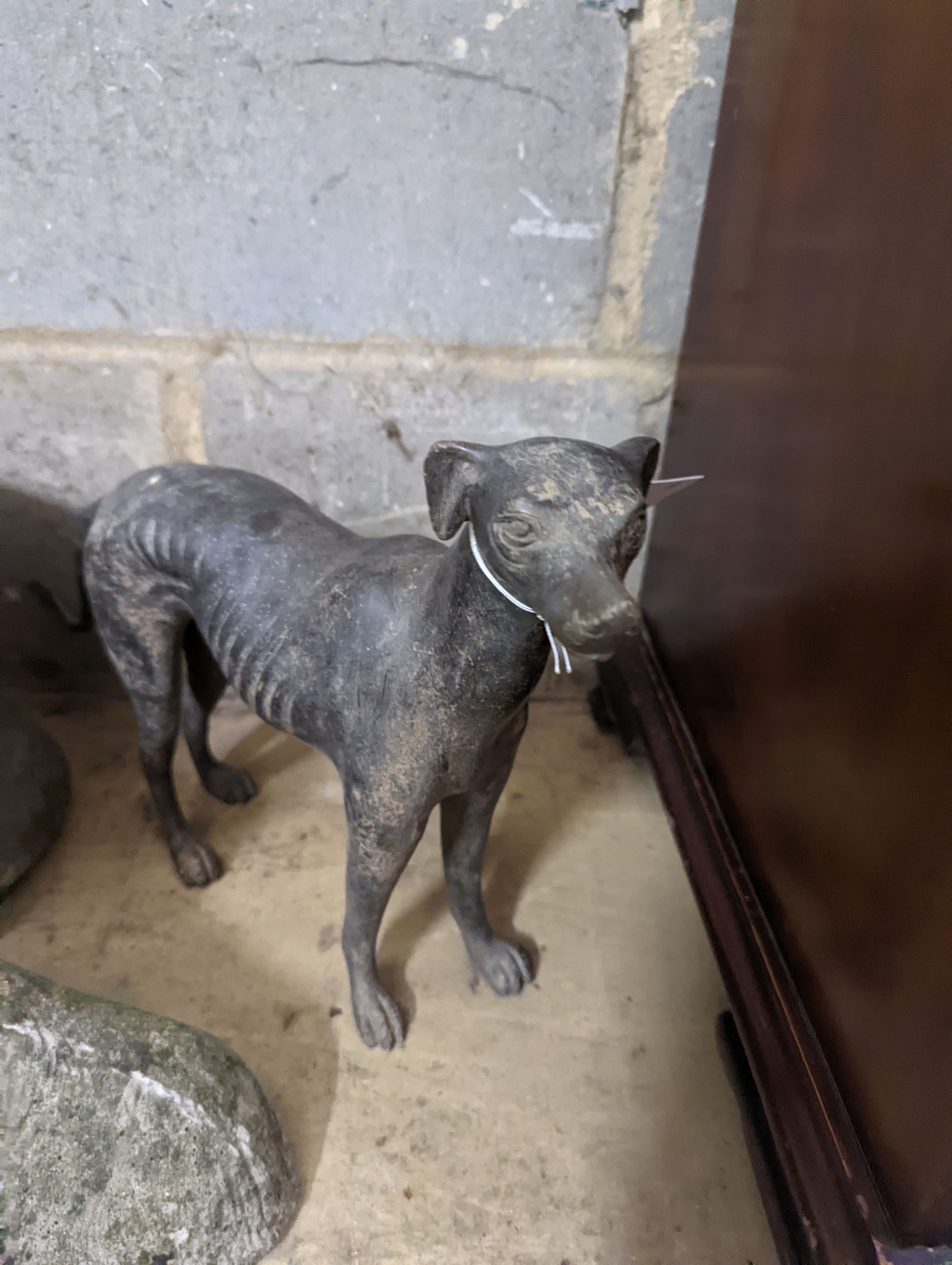 A spelter greyhound, metal pail and four garden ornaments, largest width 34cm